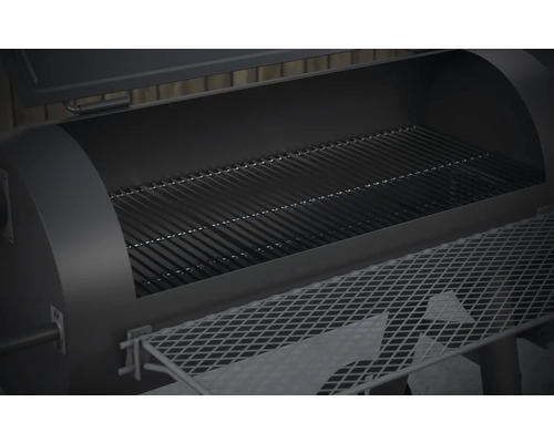 Binnenaanzicht van een open grill met rooster en opbergplank