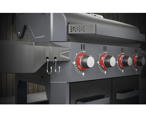 Gedetailleerde weergave van een gasbarbecue met draaiknoppen en zijplank