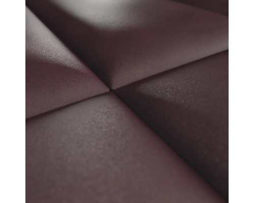 Close-up van een wandbekleding met een driedimensionale textuur