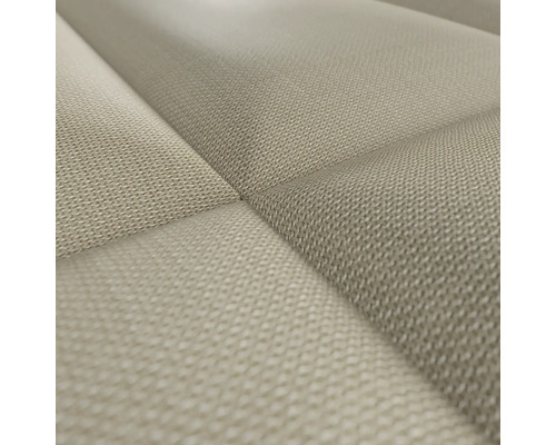 Close-up van een gestoffeerde wandpaneel met stoffen bekleding