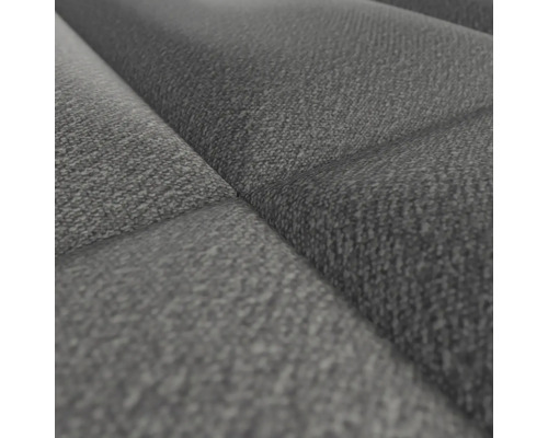 Close-up van een grijze, gewatteerde stoffen bekleding