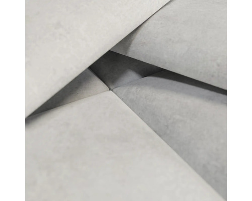 Close-up van lichtgrijze betonnen straatstenen.