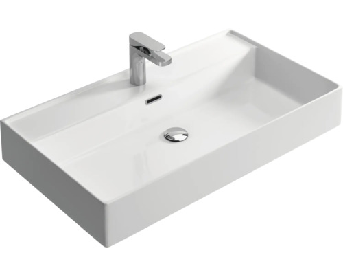 Wastafel van keramiek met kraan en overloop