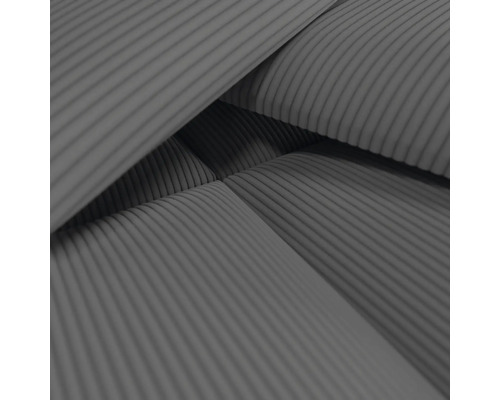 Close-up van een meubelbekleding met ribfluweelpatroon