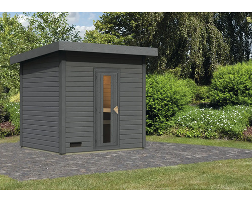 Houten sauna in de tuin met plat dak en glazen deur