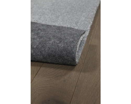 Grijze contactgeluidsisolatie op houten vloer