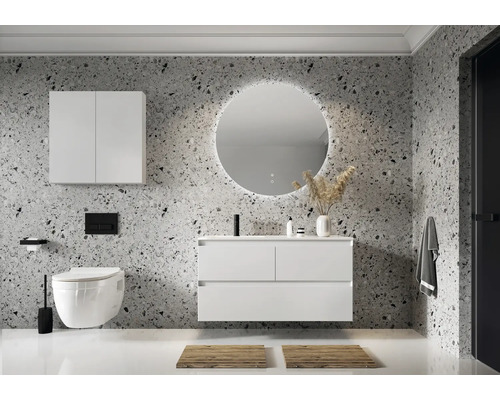 Moderne badkamer met wastafel, spiegelkast, ronde spiegel met verlichting en hangend toilet