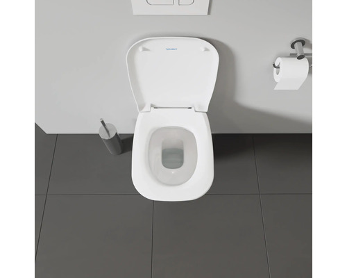 Bovenaanzicht van een toilet met open toiletdeksel en toiletpapierhouder.