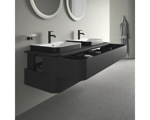 Moderne badkamer met dubbele wastafel, zwart badkamermeubel en ronde spiegels