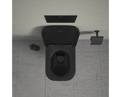 Zwart toilet met spoelbak, toiletborstel en papierhouder
