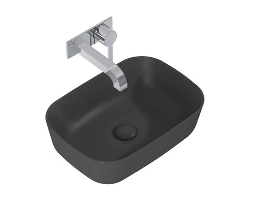 Wastafel van sanitair keramiek met kraan