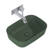 Opzetwastafel in groen met metalen wandkraan