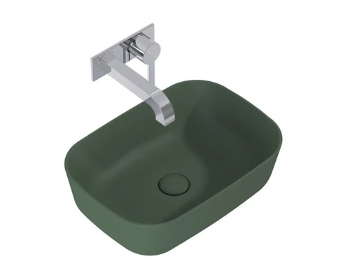 Opzetwastafel in groen met metalen wandkraan