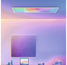 Kantoorruimte met bureau, laptop, schilderij en plafondlamp