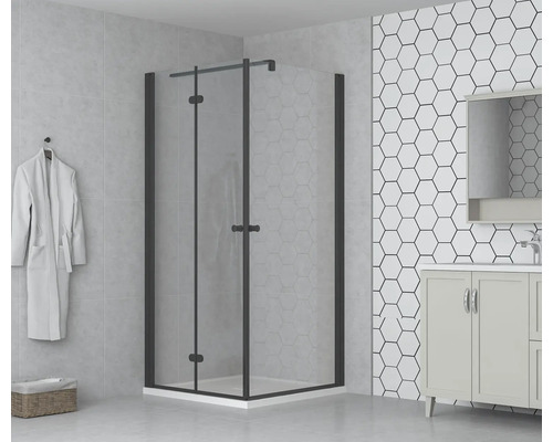 Badkamer met douchecabine met draaideur, wastafel en zeshoekige tegels