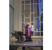 Decoratief berenfiguur met LED-kerstboom op een tafel in een kamer.