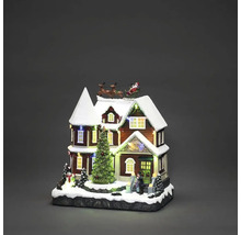 Verlicht kersthuis met kerstman in slee en kerstboom als kerstdecoratie
