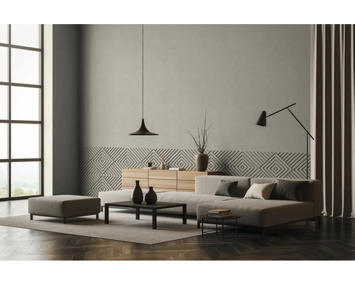 Woonkamer met bank, salontafel, dressoir, lamp en decoratie