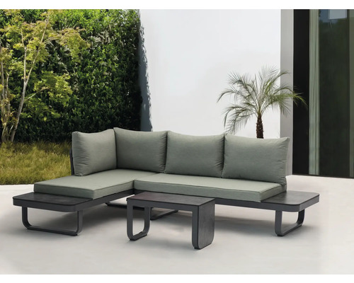 Grijze hoekbank met kussens en tafel voor buiten voor een tuinomgeving