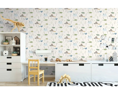 Kinderkamer met dinosaurusbehang, bureau en witte meubels