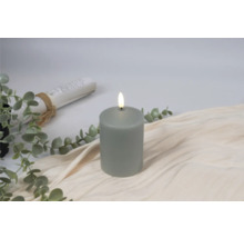 Decoratieve ledkaars op stoffen ondergrond