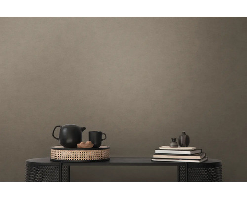 Decoratieve scène met theepot, kop, schaal en boeken op een tafel