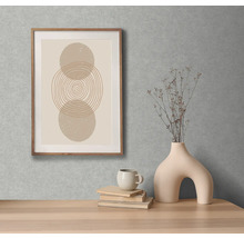 Decoratieve afbeelding met cirkelpatroon in houten frame aan de muur