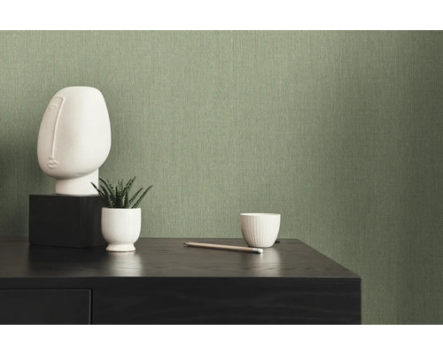 Close-up van een groene textielbehang op een muur