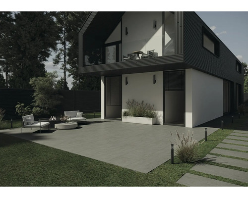 Modern huis met terras, tuinmeubelen en gazons