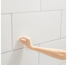 Tegels reinigen met een vochtig doekje