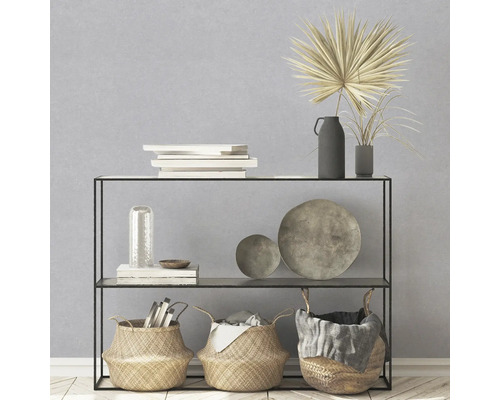 Decoratief rek met manden, boeken, schalen en vazen