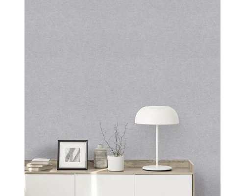 Close-up van een grijs behang met textielstructuur