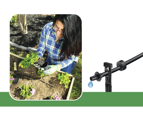 Vrouw plant bloemen in een tuin met een druppelirrigatiesysteem.