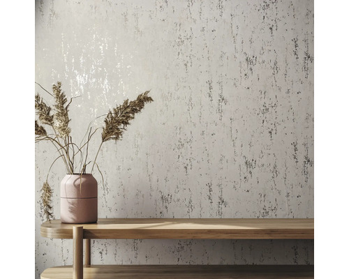 Muur met structuurbehang, tafel en vaas met droog gras