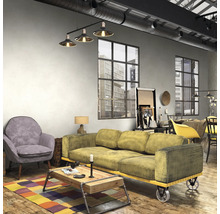 Woonkamer in loftstijl met bank, fauteuil en salontafel