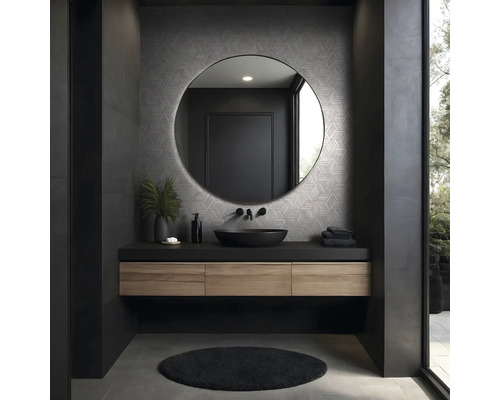 Moderne badkamer met ronde spiegel, wastafel en donkere accenten