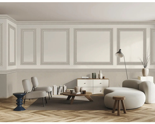 Woonkamer met lambrisering, bank, fauteuils en houten vloer