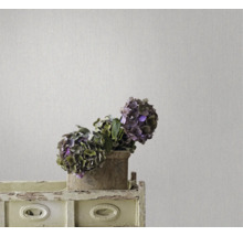 Decoratief behang met subtiele texturen en een verfijnd design in het interieur.