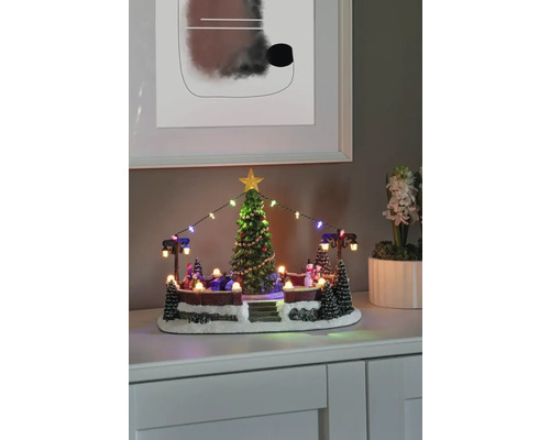 Verlichte winterdorp decoratie met kerstboom en figuren