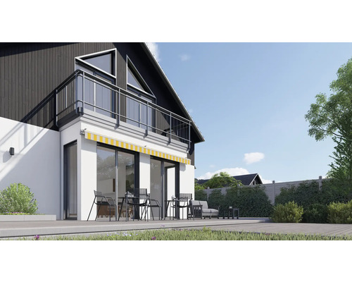 Modern huis met terras, tuinmeubilair en zonnescherm