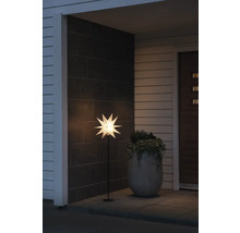 Verlichte ster als decoratie voor een huismuur.