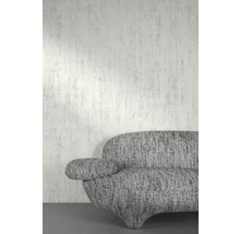 Close-up van een grijze bank tegen een wand