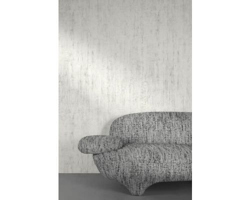 Close-up van een grijze bank tegen een wand