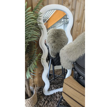 Decoratieve spiegel met golvend, zacht frame en kunstplant