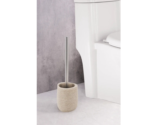 Toiletborstel met houder en roestvrijstalen handvat naast een toilet