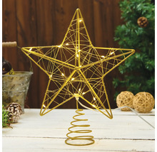 Verlichte metalen ster piek voor de kerstboom