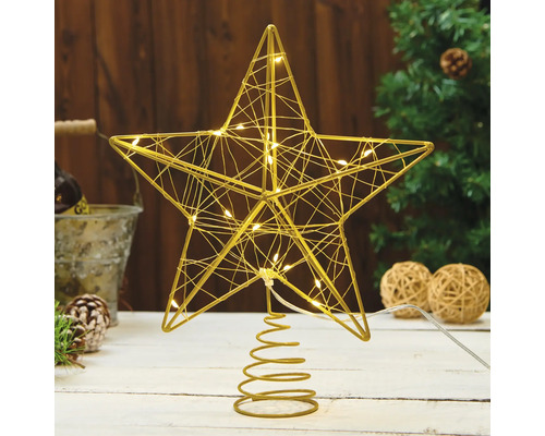 Verlichte metalen ster piek voor de kerstboom