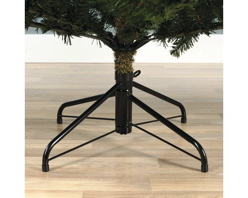 Gedetailleerde opname van de voet van een kunstkerstboom.