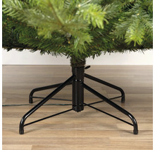 Detailopname van de zwarte metalen voet van een kunstkerstboom