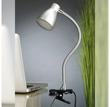 Klemspot met flexibele arm op een tafel naast een laptop.